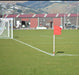 White football corner pole with red flag