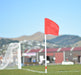 White football corner pole with red flag