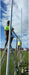 Perennial aluminium rugby post with hinge base, with crossbar being attached